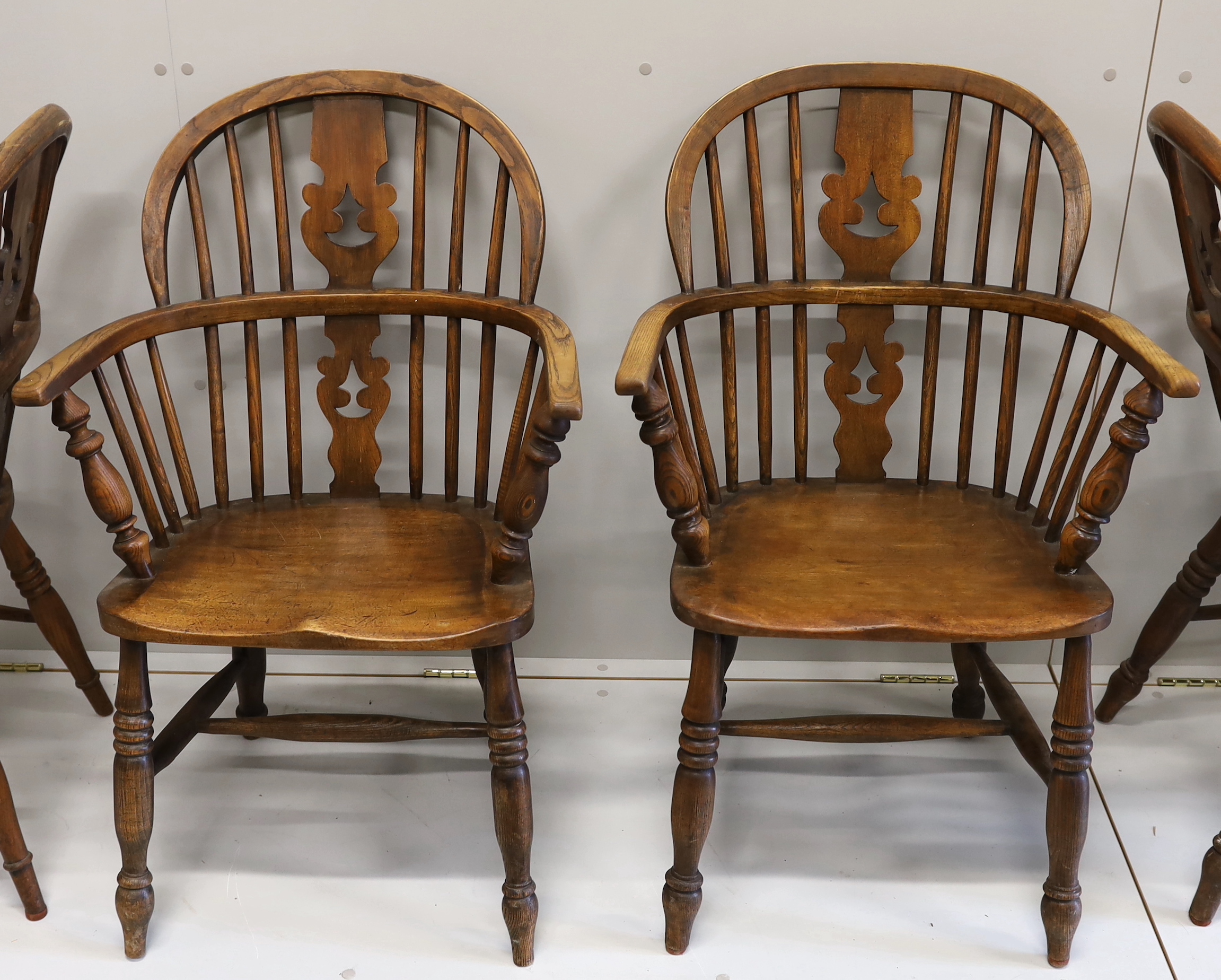 A near set of four 19th century Nottingham area elm, ash and beech Windsor elbow chairs, possibly by Allsop & Son, width 58cm, depth 39cm, height 94cm